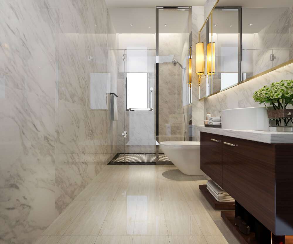 Bathroom Renovations service Marsden Park Marble-look bathroom with a glass shower, dark timber vanity and wall-hung toilet